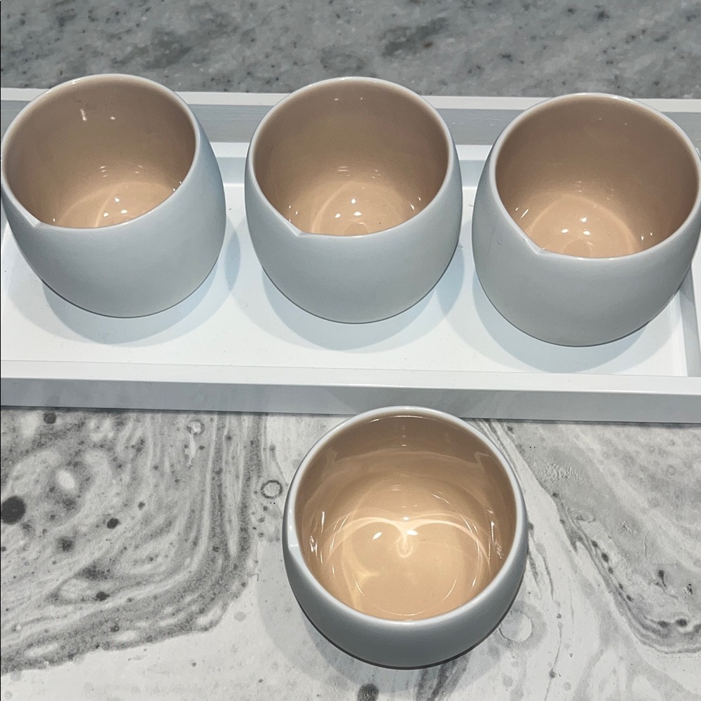 Set of Four White and Tan Ceramic Cups
